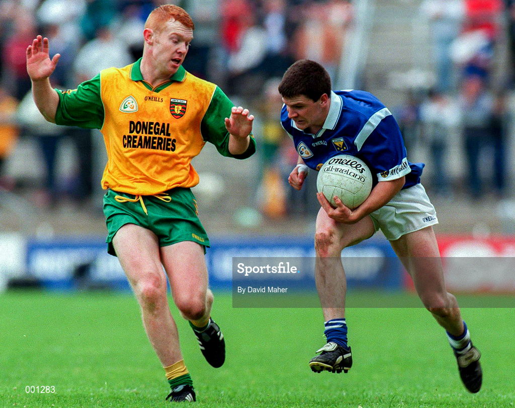22 June 1997; Larry Reilly of Cavan in action against Peter McGinley of Donegal during the Ulster GAA Football Senior Championship Semi-Final match between Cavan and Donegal at St. Tiernach's Park in Clones, Monaghan. Photo by David Maher/Sportsfile