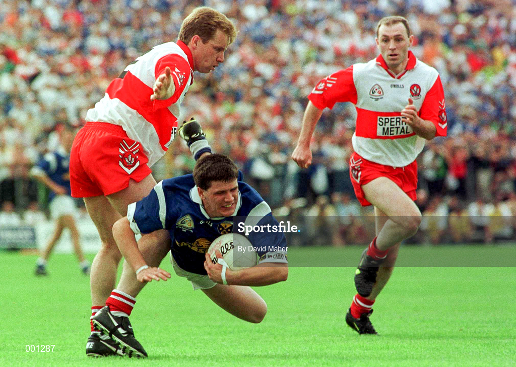 20 July 1997; Larry Reilly of Cavan in action against Kieren McKeever, left, and Henry Downey of Derry during the Ulster GAA Football Senior Championship Final match between Cavan and Derry at St. Tiernach's Park in Clones, Monaghan. Photo by David Maher/Sportsfile