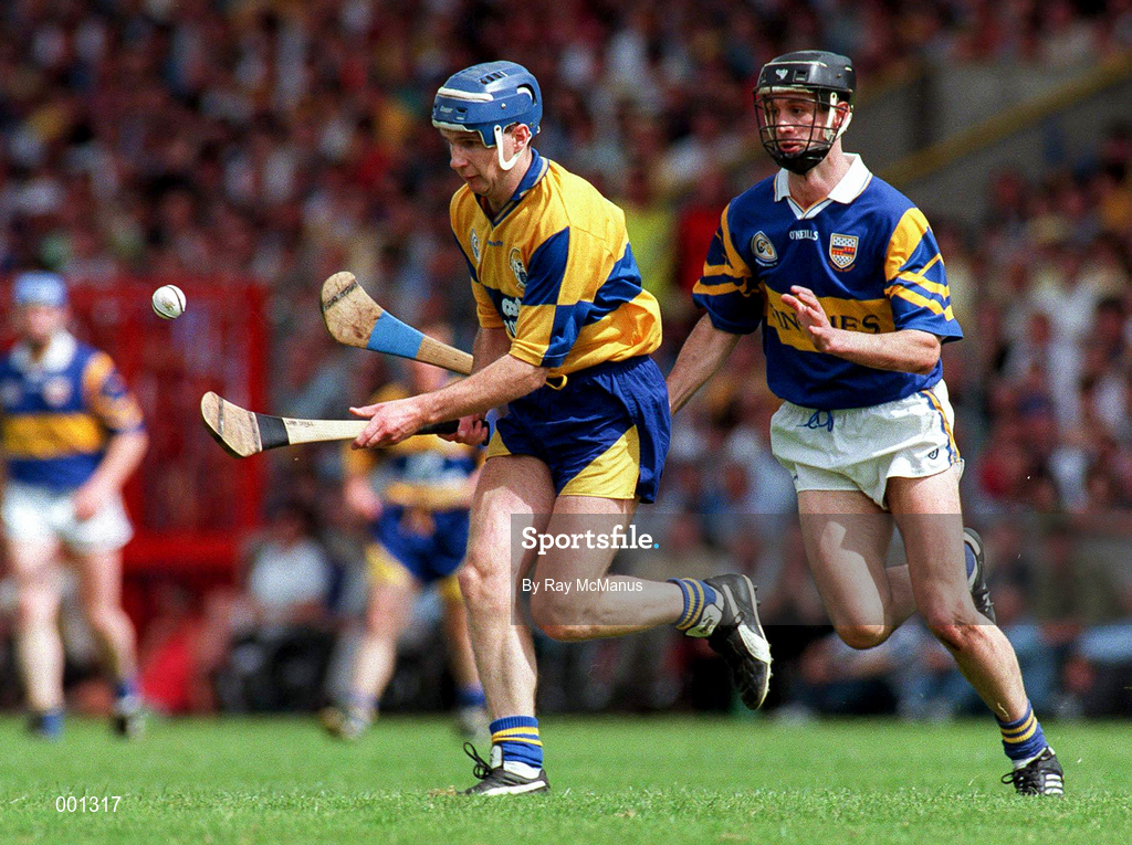 6 July 1997; Liam Doyle of Clare in action against Tomas Dunne of Tipperary during the GAA Munster Senior Hurling Championship Final match between Clare and Tipperary at Páirc Uí Chaoimh in Cork. Photo by Ray McManus/Sportsfile