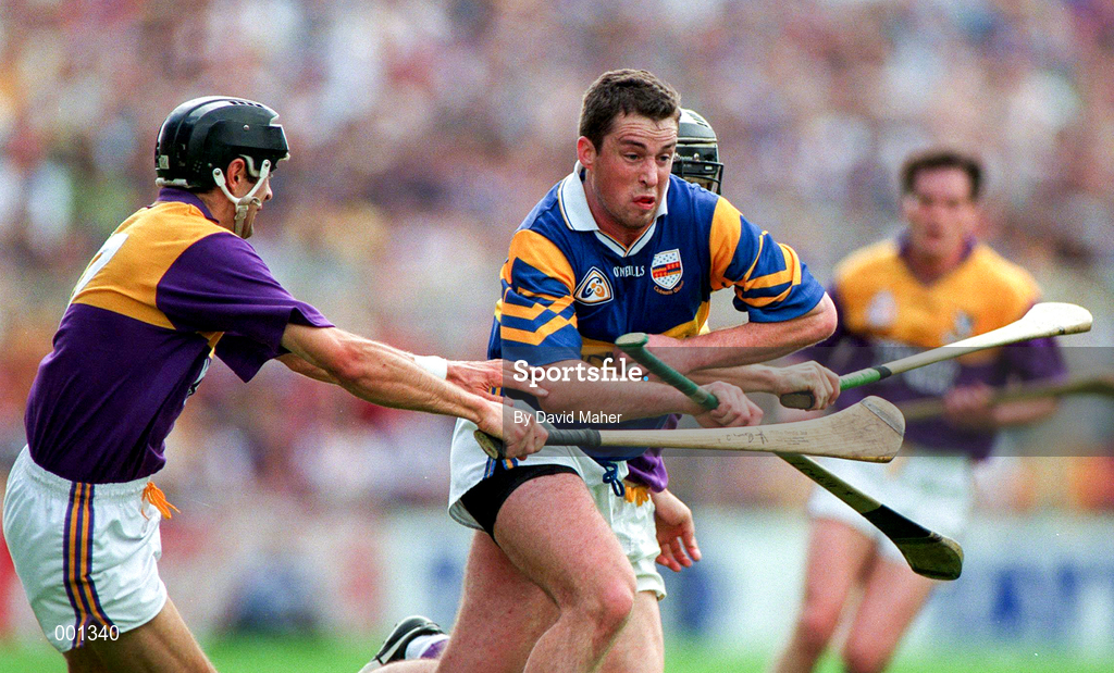 17 August 1997; Liam McGrath of Tipperary in action against John O'Connor, left, and Sean Flood of Wexford during the GAA All-Ireland Senior Hurling Championship Semi-Final match between Tipperary and Wexford at Croke Park in Dublin. Photo by David Maher/Sportsfile