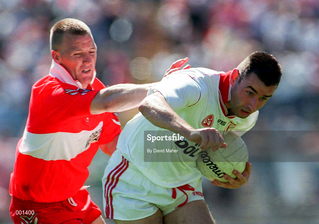29 June 1997; Matt McGleenan of Tyrone in action against Johnny McBride of Derry during the Ulster GAA Football Senior Championship Semi-Final match between Tyrone and Derry at St. Tiernach's Park in Clones, Monaghan. Photo by David Maher/Sportsfile
