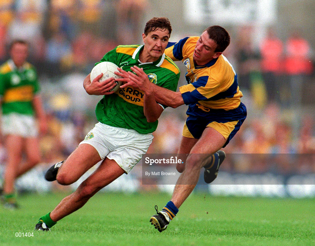 20 July 1997; Maurice Fitzgerald of Kerry in action against Padraig Gallagher of Clare during the GAA Munster Senior Football Championship Final match between Kerry and Clare at Gaelic Grounds in Limerick. Photo by Matt Browne/Sportsfile