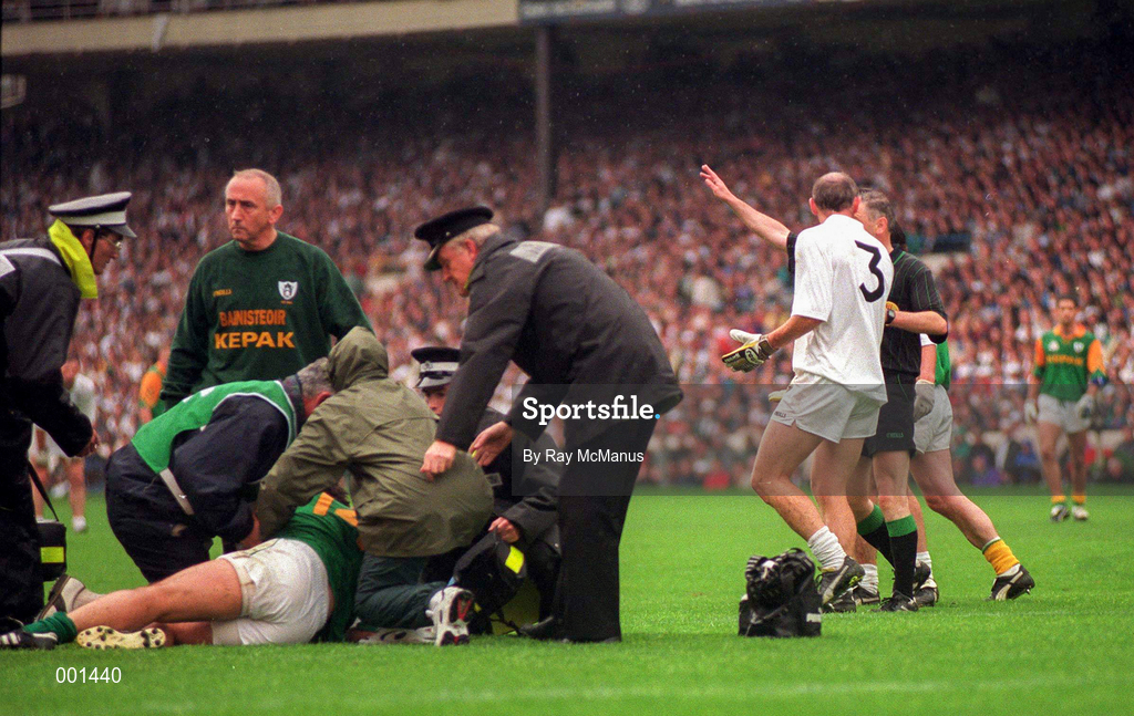 3 August 1997; Davy Dalton of Kildare is sent off by referee Pat O'Toole as Brendan Reilly of Meath receives medical attention during the Leinster GAA Senior Football Championship Semi-Final Second Replay match between Kildare and Meath at Croke Park in Dublin. Photo by Ray McManus/Sportsfile