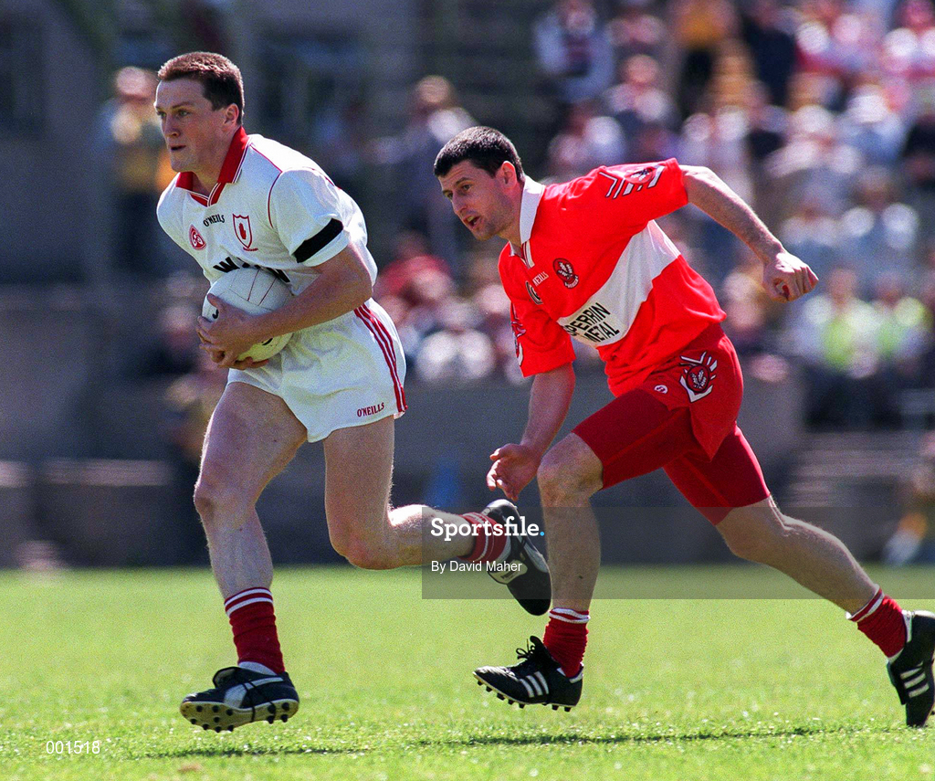 29 June 1997; Noel Donnelly of Tyrone in action against Fergal McCusker of Derry during the Ulster GAA Football Senior Championship Semi-Final match between Tyrone and Derry at St. Tiernach's Park in Clones, Monaghan. Photo by David Maher/Sportsfile