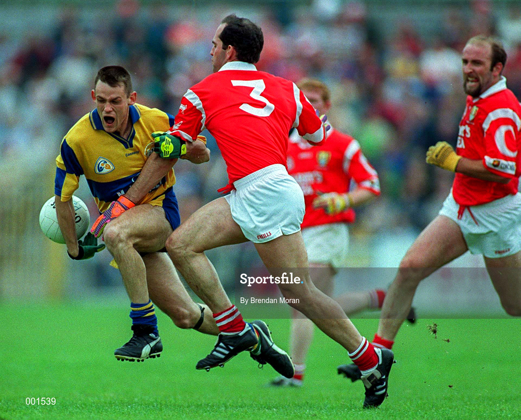 22 June 1997; Odhran O'Dwyer of Clare in action against Mark O'Connor, centre, and Brian Corcoran of Cork during the GAA Munster Senior Football Championship Semi-Final match between Clare and Cork at Cusack Park in Ennis, Clare. Photo by Brendan Moran/Sportsfile