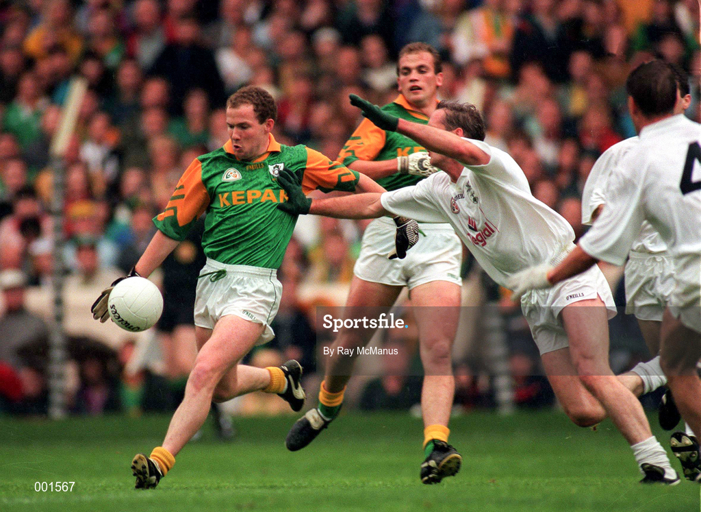 3 August 1997; Ollie Murphy of Meath shoots for a score despite the attention of Willie McCreery of Kildare during the Leinster GAA Senior Football Championship Semi-Final Second Replay match between Kildare and Meath at Croke Park in Dublin. Photo by Ray McManus/Sportsfile