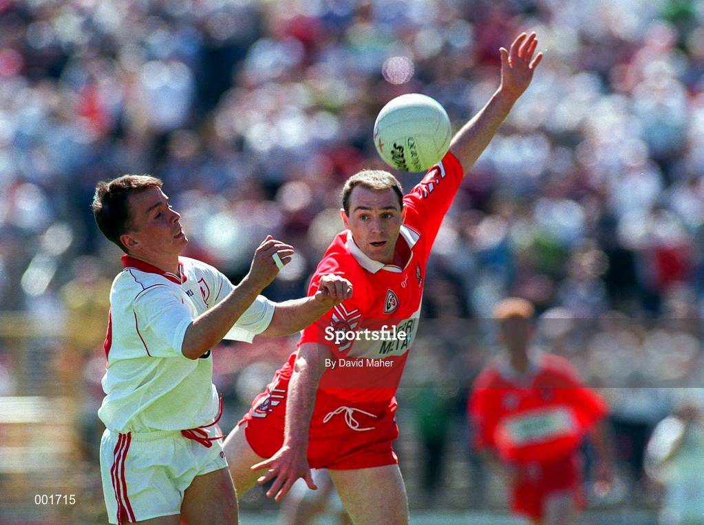 29 June 1997; Pascal Canavan of Tyrone in action against Henry Downey of Derry during the Ulster GAA Football Senior Championship Semi-Final match between Tyrone and Derry at St. Tiernach's Park in Clones, Monaghan. Photo by David Maher/Sportsfile