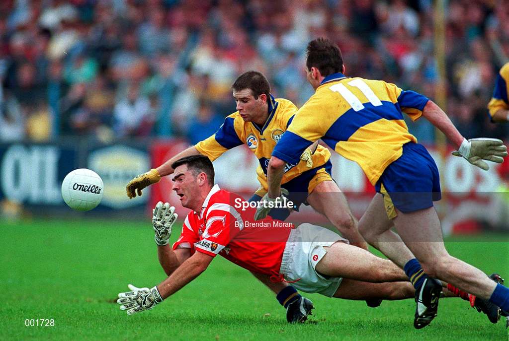 22 June 1997; Pat Hegarty of Cork in action against Francis McInerney, right, and Ger Keane of Clare during the GAA Munster Senior Football Championship Semi-Final match between Clare and Cork at Cusack Park in Ennis, Clare. Photo by Brendan Moran/Sportsfile