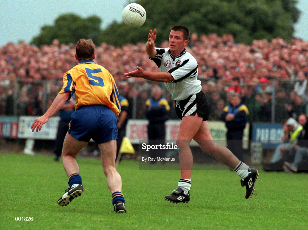 22 June 1997; Paul Taylor of Sligo makes a pass, despite the efforts of Rossa O'Callaghan of Roscommon during the Connacht GAA Senior Football Championship Semi-Final match between Sligo and Roscommon at Markievicz Park in Sligo. Photo by Ray McManus/Sportsfile