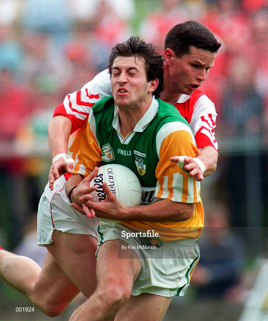 29 June 1997; Roy Malone of Offaly is tackled by Gareth O'Neill of Louth during the Leinster GAA Senior Football Championship Semi-Final match between Offaly and Louth at Páirc Tailteann in Navan, Meath. Photo by Ray McManus/Sportsfile