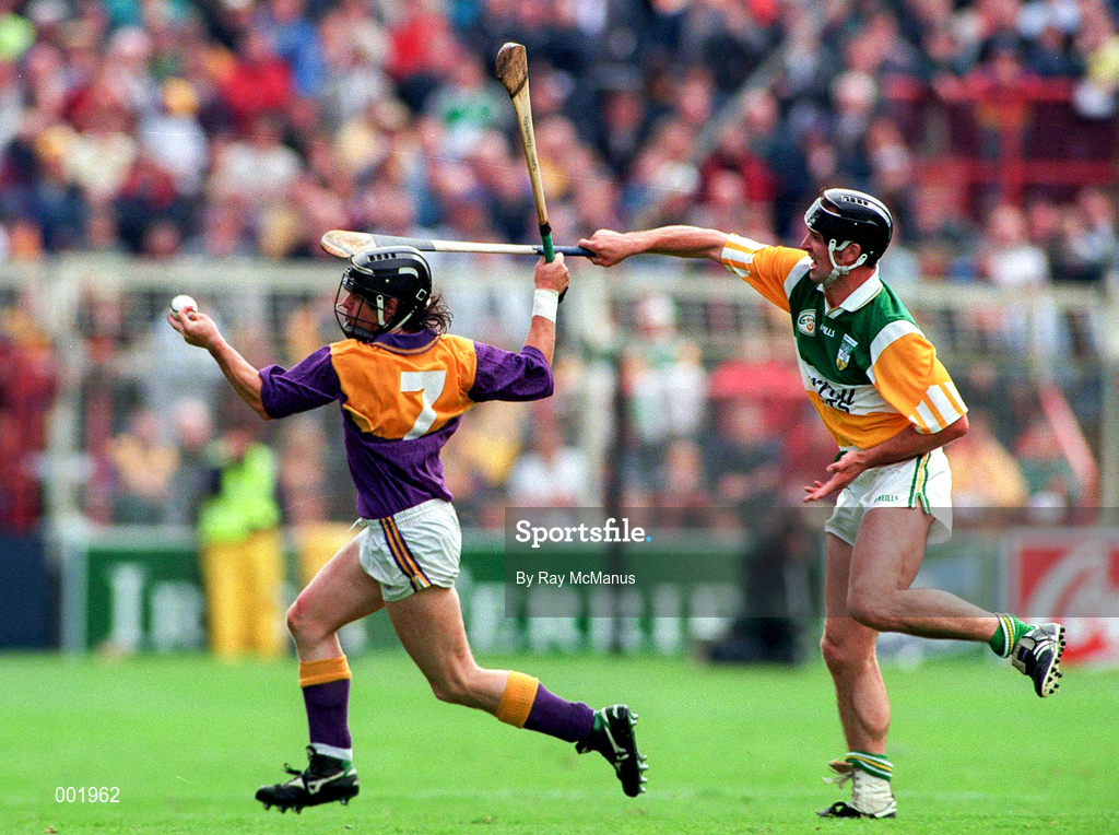 22 June 1997; Sean Flood Wexford in action against Billy Dooley of Offaly during the GAA Leinster Senior Hurling Championship Semi-Final match between Wexford and Offaly at Croke Park in Dublin. Photo by Ray McManus/Sportsfile
