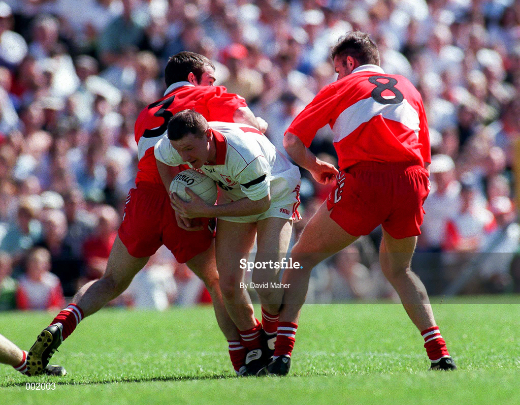 29 June 1997; Stephen Lawn of Tyrone in action against David O'Neill and Anthony Tohill of Derry during the Ulster GAA Football Senior Championship Semi-Final match between Tyrone and Derry at St. Tiernach's Park in Clones, Monaghan. Photo by David Maher/Sportsfile