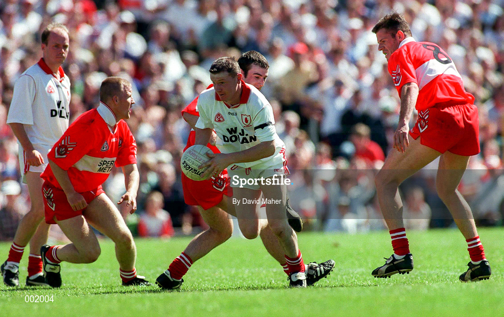 29 June 1997; Stephen Lawn of Tyrone in action against, from left, Johnny McBride, David O'Neill, and Anthony Tohill of Derry during the Ulster GAA Football Senior Championship Semi-Final match between Tyrone and Derry at St. Tiernach's Park in Clones, Monaghan. Photo by David Maher/Sportsfile