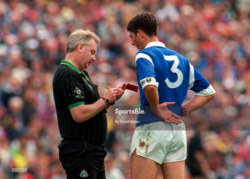 22 June 1997; Terry Farrelly of Cavan is booked by Referee Jim Curran during the Ulster GAA Football Senior Championship Semi-Final match between Cavan and Donegal at St. Tiernach's Park in Clones, Monaghan. Photo by David Maher/Sportsfile