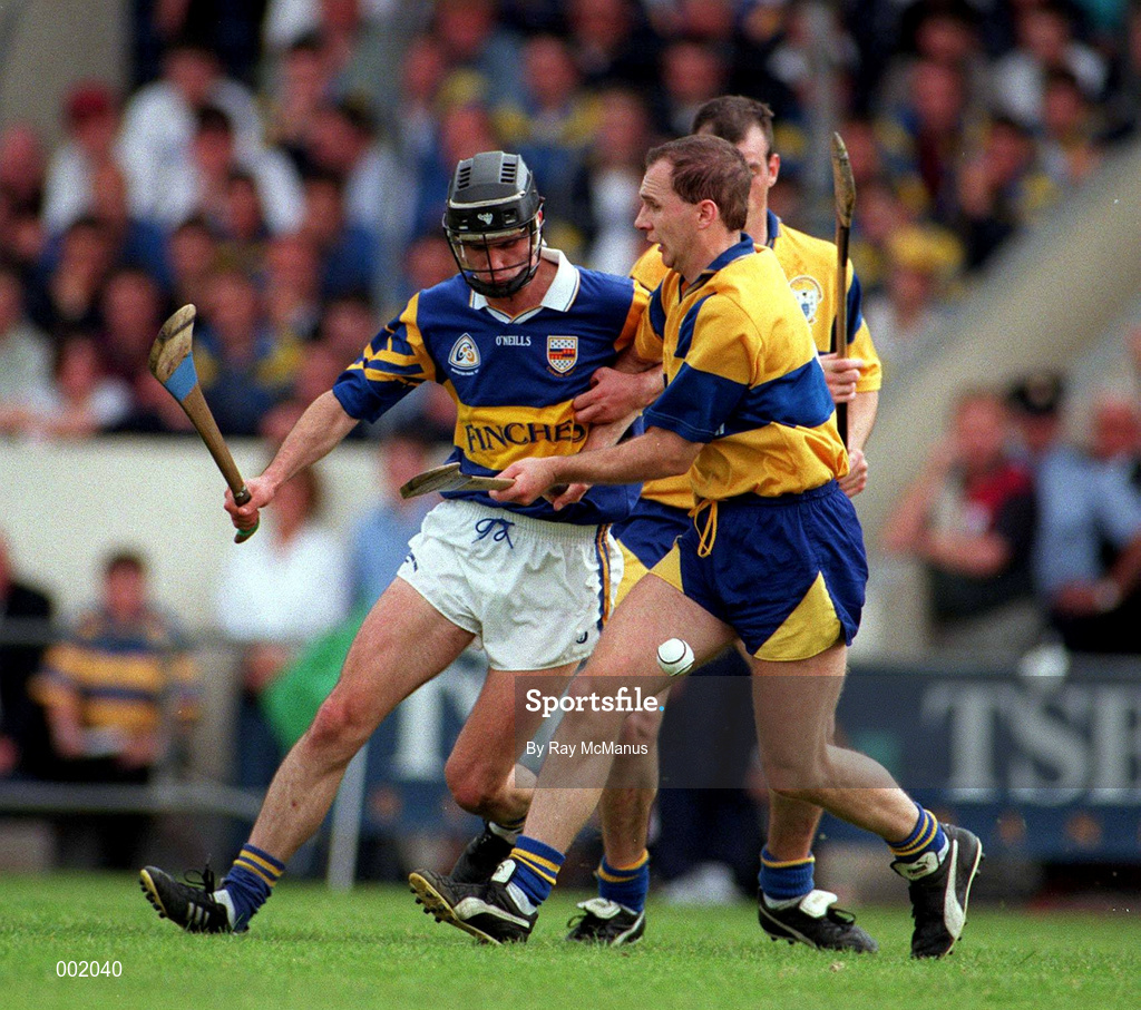6 July 1997; Thomas Dunne of Tipperary in action against Liam Doyle of Clare during the Guinness Munster Senior Hurling Championship Final match between Clare and Tipperary at Páirc Uí Chaoimh in Cork. Photo by Ray McManus/Sportsfile