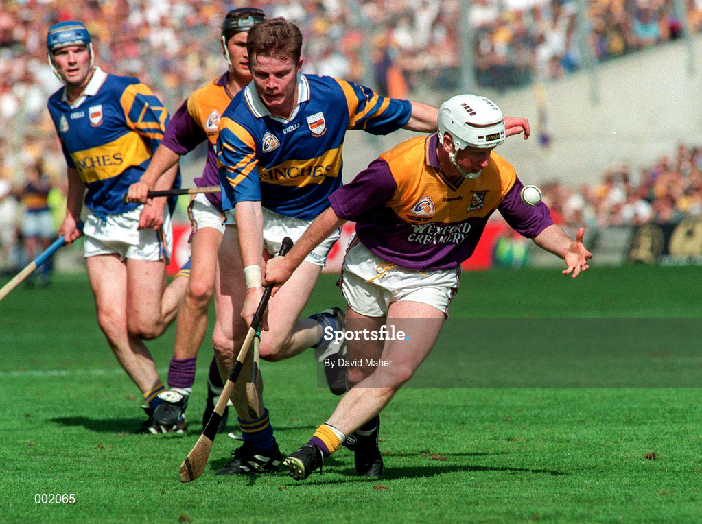 17 August 1997; Tom Dempsey of Wexford in action against Conor Gleeson of Tipperary during the GAA All-Ireland Senior Hurling Championship Semi-Final match between Tipperary and Wexford at Croke Park in Dublin. Photo by David Maher/Sportsfile