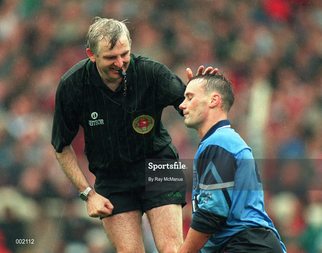 18 September 1994; Referee Tommy Sugrue with Paul Curran of Dublin during the All-Ireland Senior Football Championship Final between Dublin and Down at Croke Park in Dublin. Photo by Ray McManus/Sportsfile