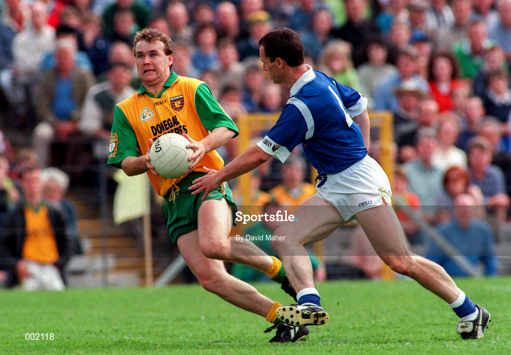 22 June 1997; Tony Boyle of Donegal in action against Damien O'Reilly of Cavan during the Ulster GAA Football Senior Championship Semi-Final match between Cavan and Donegal at St. Tiernach's Park in Clones, Monaghan. Photo by David Maher/Sportsfile