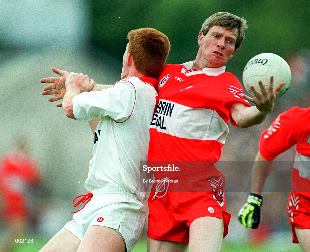 29 June 1997; Tony Scullion of Derry in action against Ciaran McBride of Tyrone during the Ulster GAA Football Senior Championship Semi-Final match between Tyrone and Derry at St. Tiernach's Park in Clones, Monaghan. Photo by Brendan Moran/Sportsfile