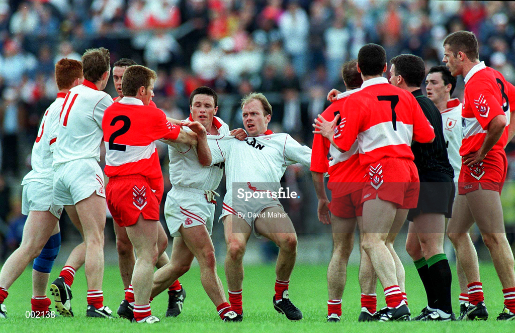 30 June 1996; Players from both the Derry and Tyrone Teams, including Peter Canavan of Tyrone, centre, who was later sent off, have a heated exchange during the Ulster Senior Football Championship Semi-Final at St Tiernach's Park in Clones. Photo by David Maher/Sportsfile