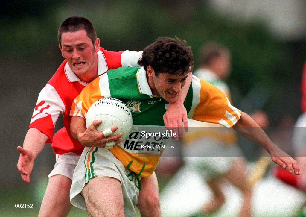 29 June 1997; Vinny Claffey of Offaly in action against Ray Rooney of Louth during the Leinster GAA Senior Football Championship Semi-Final match between Offaly and Louth at Páirc Tailteann in Navan, Co Meath. Photo by Ray McManus/Sportsfile
