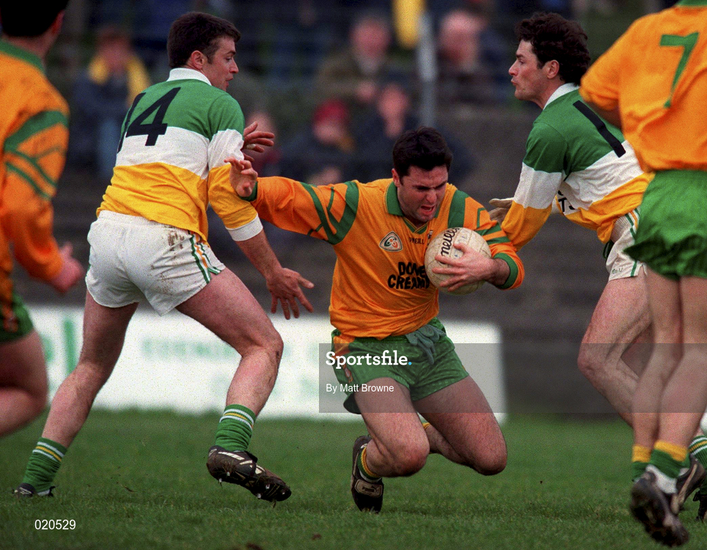 14 March 1999; Barry Ward of Donegal in action against Sean Grennan, left, ond Vinny Claffey of Offaly during the Church and General National Football League Division 1 match between Offaly and Donegal at O'Connor Park in Tullamore, Offaly. Photo by Matt Browne/Sportsfile