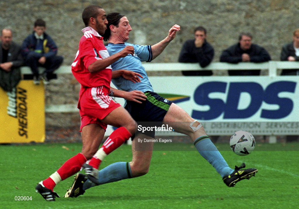 27 September 1998; Clive Delaney of UCD in action against Jason Kabia of Cork City during the Harp Lager National League Premier Division match between UCD and Cork City at Belfield Park in Dublin. Photo by Damien Eagers/Sportsfile