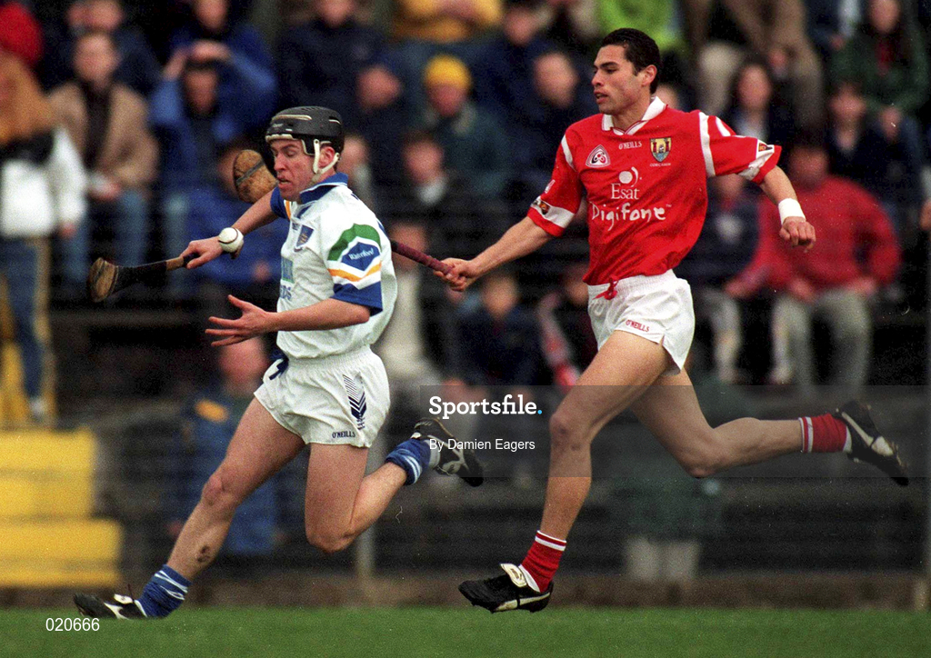27 March 1999; Dave Bennett of Waterford in action against Sean Og O hAilpin of Cork during the Church and General National Hurling League Division 1B match between Cork and Waterford at Páirc Uí Rinn in Cork. Photo by Damien Eagers/Sportsfile
