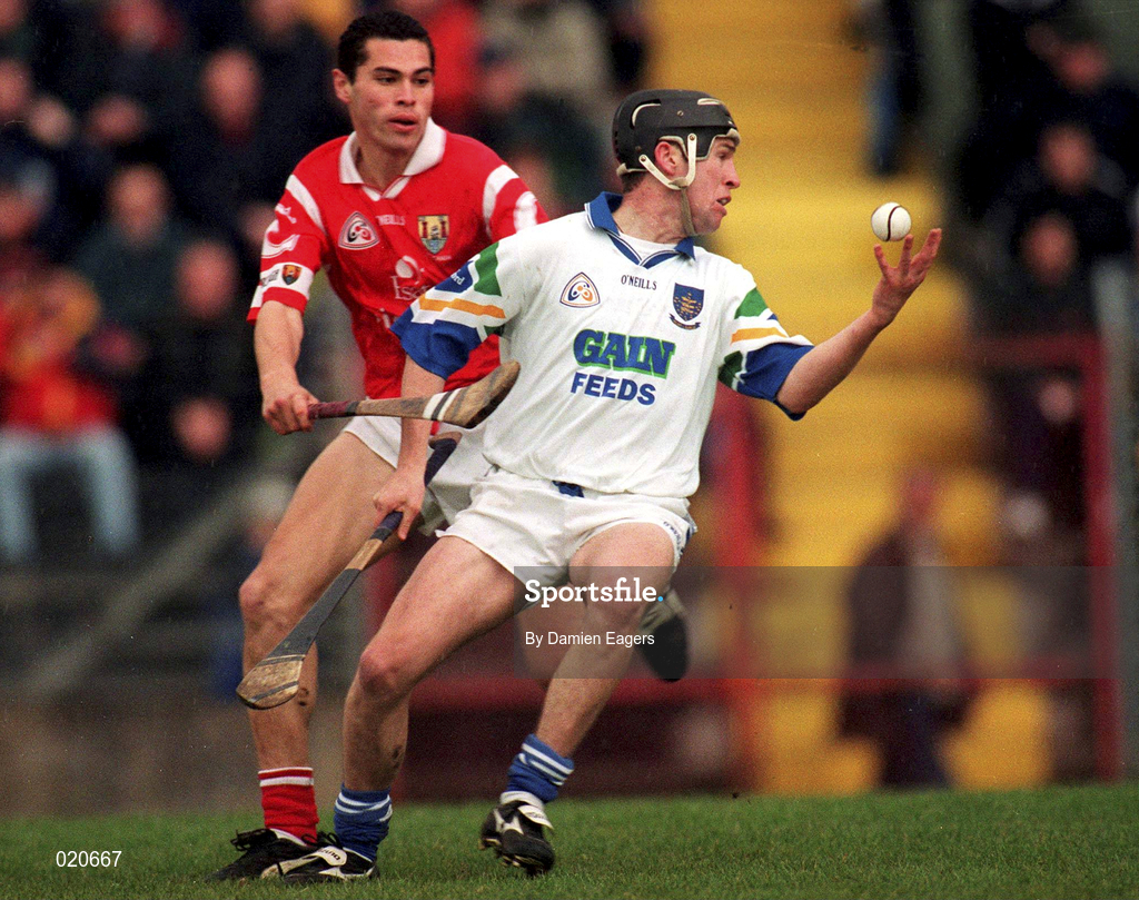 27 March 1999; Dave Bennett of Waterford in action against Sean Og O hAilpin of Cork during the Church and General National Hurling League Division 1B match between Cork and Waterford at Páirc Uí Rinn in Cork. Photo by Damien Eagers/Sportsfile