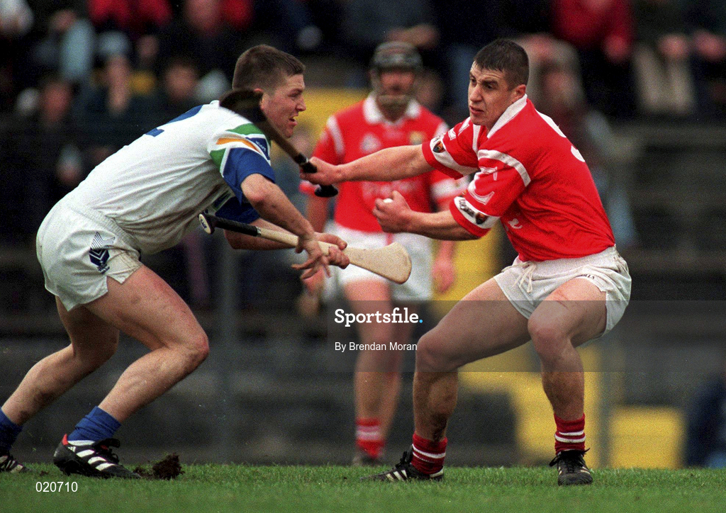 27 March 1999; Derek Barrett of Cork in action against Ken McGrath of Waterford during the Church and General National Hurling League Division 1B match between Cork and Waterford at Páirc Uí Rinn in Cork. Photo by Brendan Moran/Sportsfile