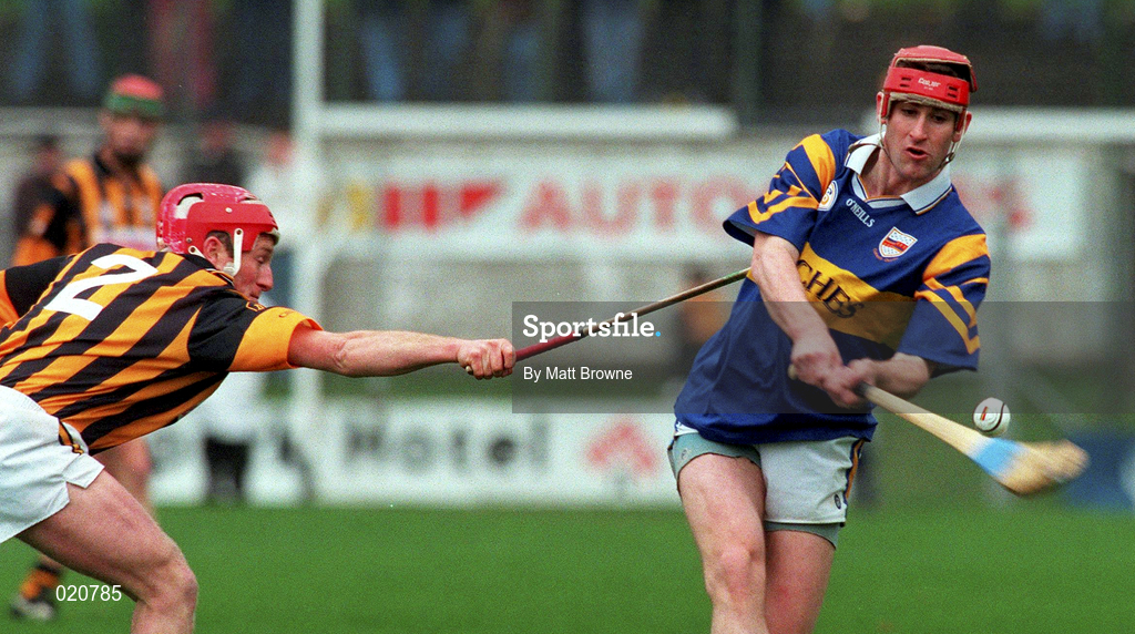 28 March 1999; Eddie Tucker of Tipperary in action against Johnny Butler of Kilkenny during the Church and General National Hurling League Division 1B match between Kilkenny and Tipperary at Nowlan Park in Kilkenny. Photo by Matt Browne/Sportsfile