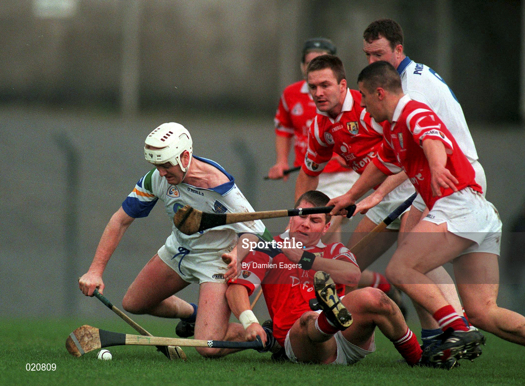 27 March 1999; Fergal Hartley of Waterford is tackled by Diarmuid O'Sullivan during the Church and General National Hurling League Division 1B match between Cork and Waterford at Páirc Uí Rinn in Cork. Photo by Damien Eagers/Sportsfile