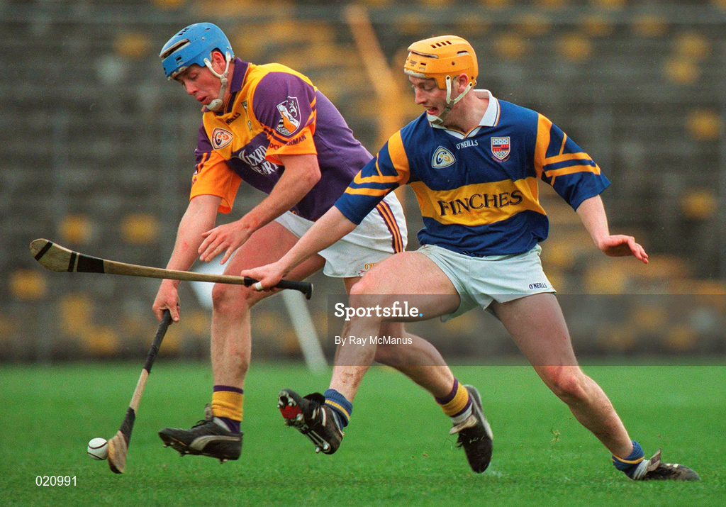 21 March 1999; Eugene Furlong of Wexford in action against Liam Cahill of Tipperary during the Church and General National Hurling League Division 1B match between Tipperary and Wexford at Semple Stadium in Thurles, Tipperary. Photo by Ray McManus/Sportsfile