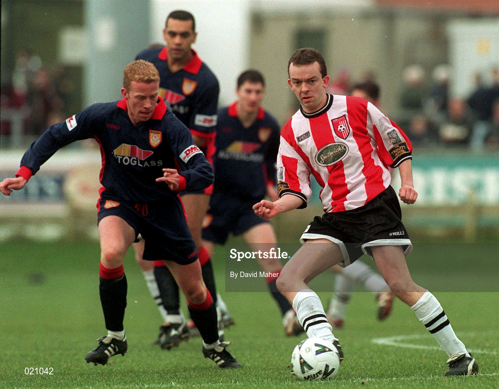 14 February 1999; Michael McHugh of Derry City in action against Stephen McGuinness of St Patrick's Athletic during the Harp Lager National League Premier Division match between Derry City and St Patrick's Athletic at The Brandywell Stadium in Derry. Photo by David Maher/Sportsfile