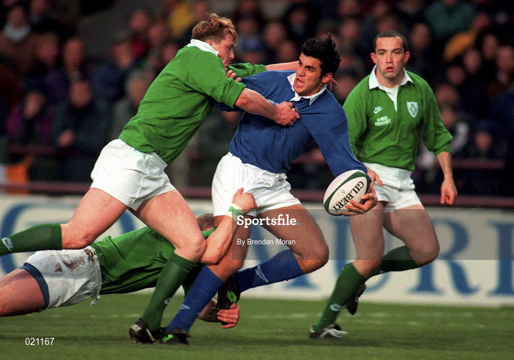 4 January 1997; Paolo Vaccari of Italy is tackled by Eric Miller and David Corkery of Ireland during the International Rugby match between Ireland and Italy at Lansdowne Road in Dublin. Photo by Brendan Moran/Sportsfile