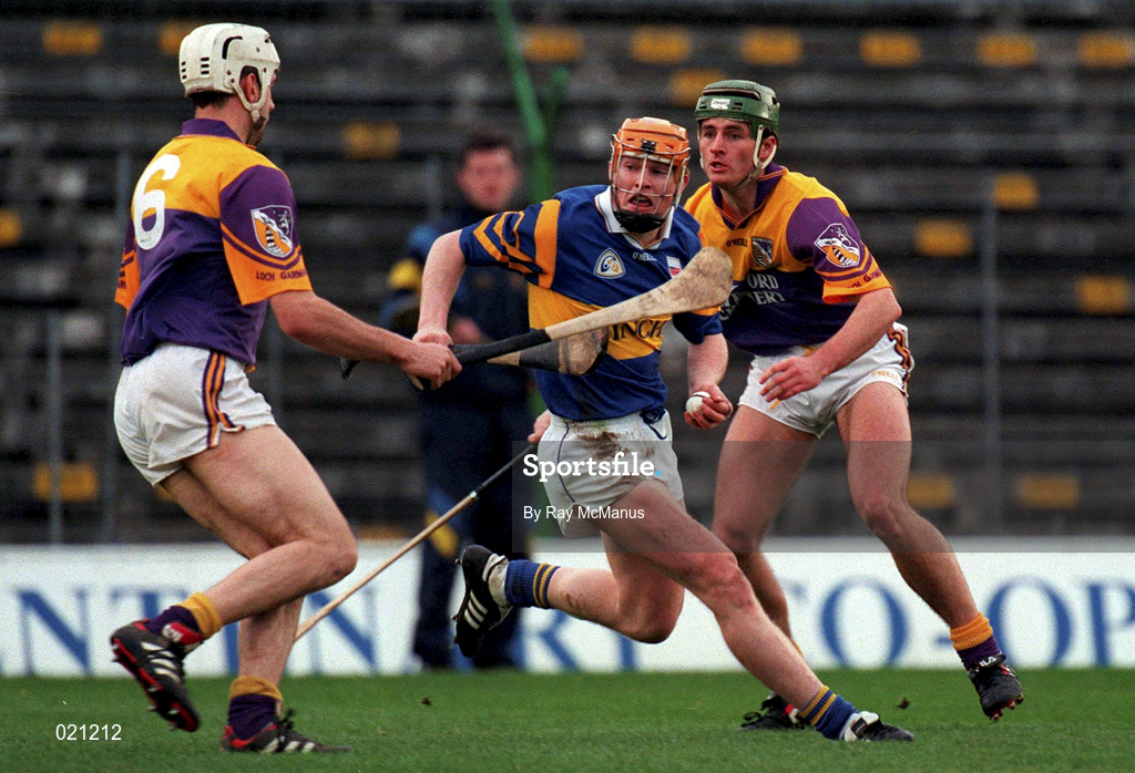 21 March 1999; Paul Ormode of Tipperary in action against Darragh Ryan, left, and Rory McCarthy of Wexford during the Church and General National Hurling League Division 1B match between Tipperary and Wexford at Semple Stadium in Thurles, Tipperary. Photo by Ray McManus/Sportsfile