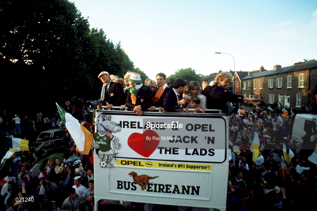 1 July 1990; the Republic of Ireland squad, including manager Jack Charlton and players Frank Stapleton, Kevin Sheedy and John Byrne, are cheered by supporters as they are brought by open top bus from Dublin Airport to College Green in Dublin city centre on their arrival home for a homecoming reception after their participation in the 1990 FIFA World Cup Finals in Italy. Photo by Ray McManus/Sportsfile