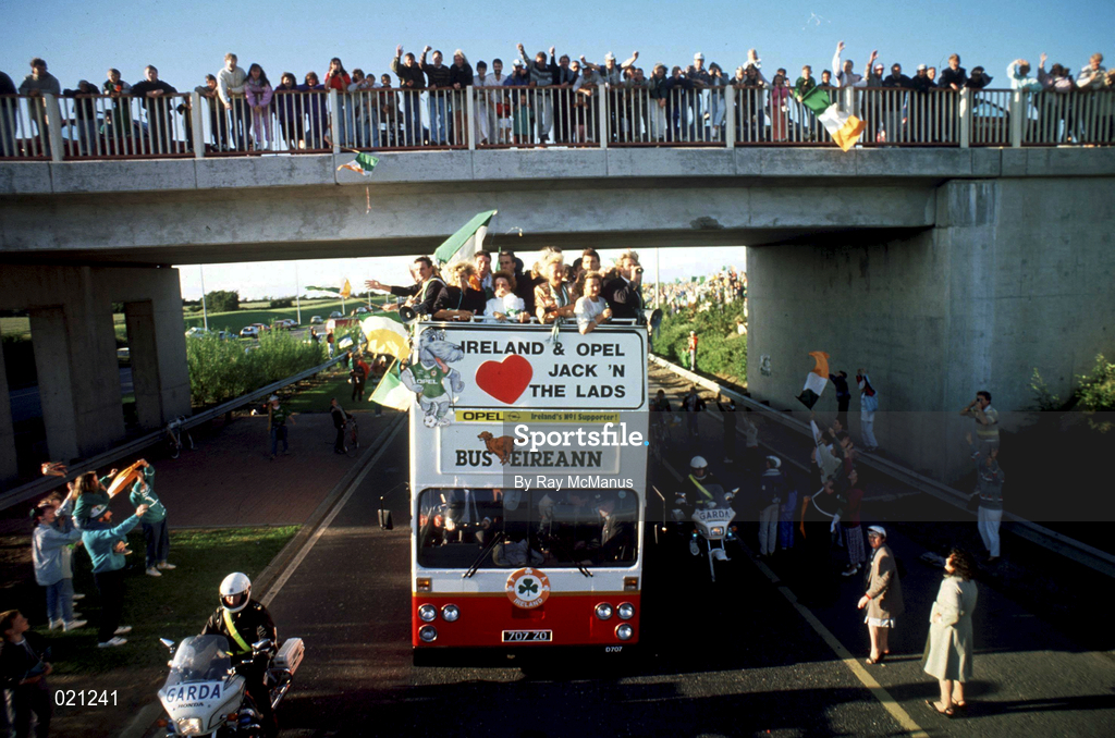 1 July 1990; the Republic of Ireland squad are cheered by supporters as they are brought by open top bus from Dublin Airport to College Green in Dublin city centre on their arrival home for a homecoming reception after their participation in the 1990 FIFA World Cup Finals in Italy. Photo by Ray McManus/Sportsfile