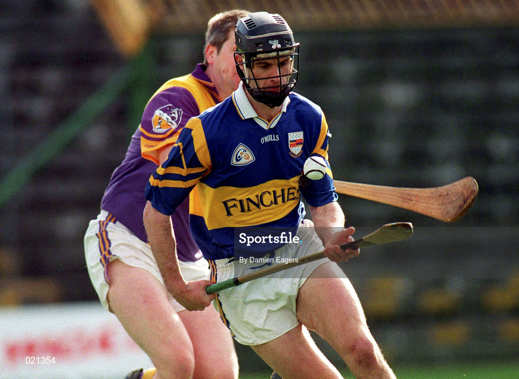 21 March 1999; Thomas Dunne of Tipperary in action against Ger Cushe of Wexford during the Church and General National Hurling League Division 1B match between Tipperary and Wexford at Semple Stadium in Thurles, Tipperary. Photo by Damien Eagers/Sportsfile