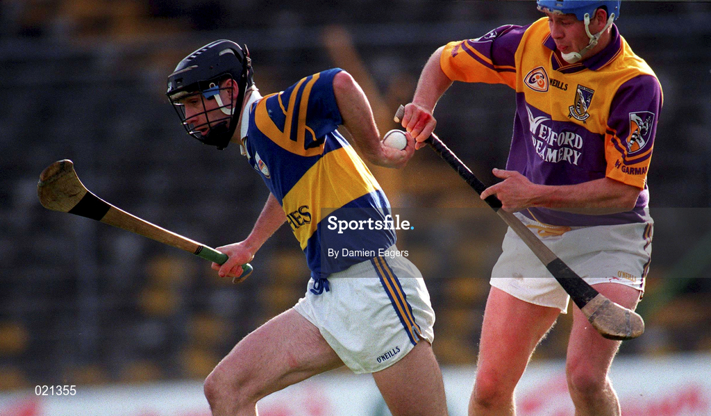 21 March 1999; Thomas Dunne of Tipperary in against Eugene Furlong of Wexford during the Church and General National Hurling League Division 1B match between Tipperary and Wexford at Semple Stadium in Thurles, Tipperary. Photo by Damien Eagers/Sportsfile