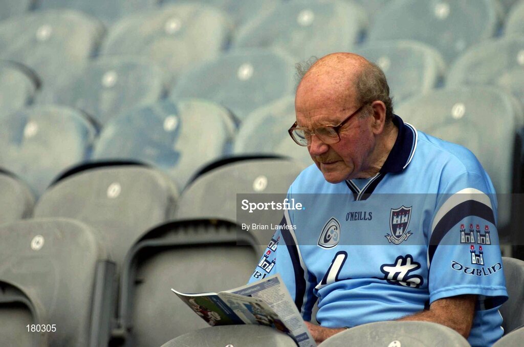 19 June 2005; A Dublin fan, Tom King, Na Fianna, reads his programme as he awaits the start of the match. Bank of Ireland Leinster Senior Football Championship Semi-Final, Dublin v Wexford, Croke Park, Dublin. Picture credit; Brian Lawless / SPORTSFILE