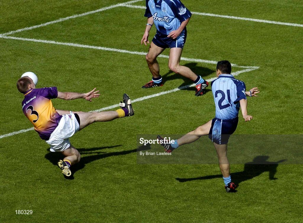 19 June 2005; Dublin's Jason Sherlock shoots to score his sides only goal despite the efforts of Philip Wallace, Wexford. Bank of Ireland Leinster Senior Football Championship Semi-Final, Dublin v Wexford, Croke Park, Dublin. Picture credit; Brian Lawless / SPORTSFILE