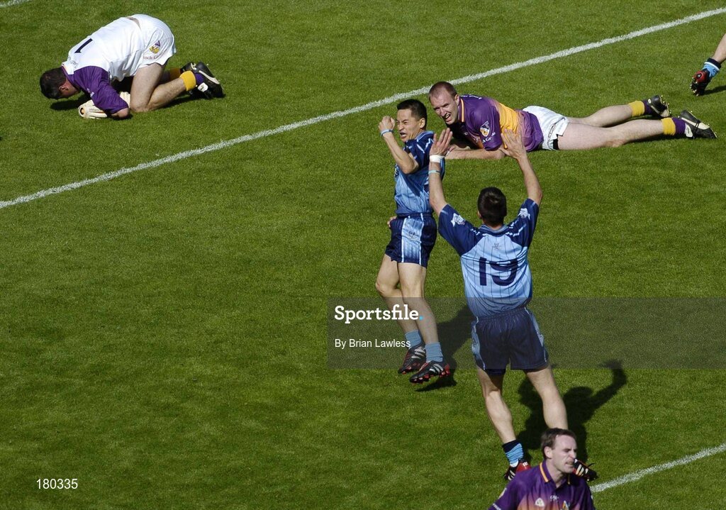 19 June 2005; Dublin's Jason Sherlock and team-mate Senan Connell (19) celebrate after Sherlock had scored his sides only goal as Wexford goalkeeper John Cooper and team-mate Philip Wallace lie dejected on the ground. Bank of Ireland Leinster Senior Football Championship Semi-Final, Dublin v Wexford, Croke Park, Dublin. Picture credit; Brian Lawless / SPORTSFILE