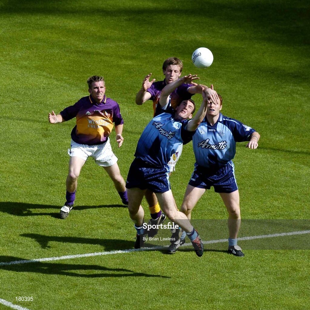 19 June 2005; Dublin's Paddy Christie in action against Wexford's David Fogarty as team-mate Peadar Andrews and Wexford's PJ. Banville look on. Bank of Ireland Leinster Senior Football Championship Semi-Final, Dublin v Wexford, Croke Park, Dublin. Picture credit; Brian Lawless / SPORTSFILE