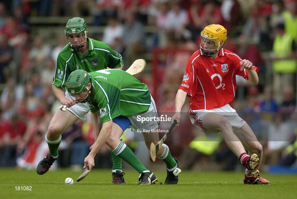 26 June 2005; Seamus Hickey, Limerick, assisted by David Moloney, prepares to clear under pressure from Cathal Naughton, Cork. Munster Minor Hurling Championship Final, Cork v Limerick, Pairc Ui Chaoimh, Cork. Picture Credit; Ray McManus / SPORTSFILE