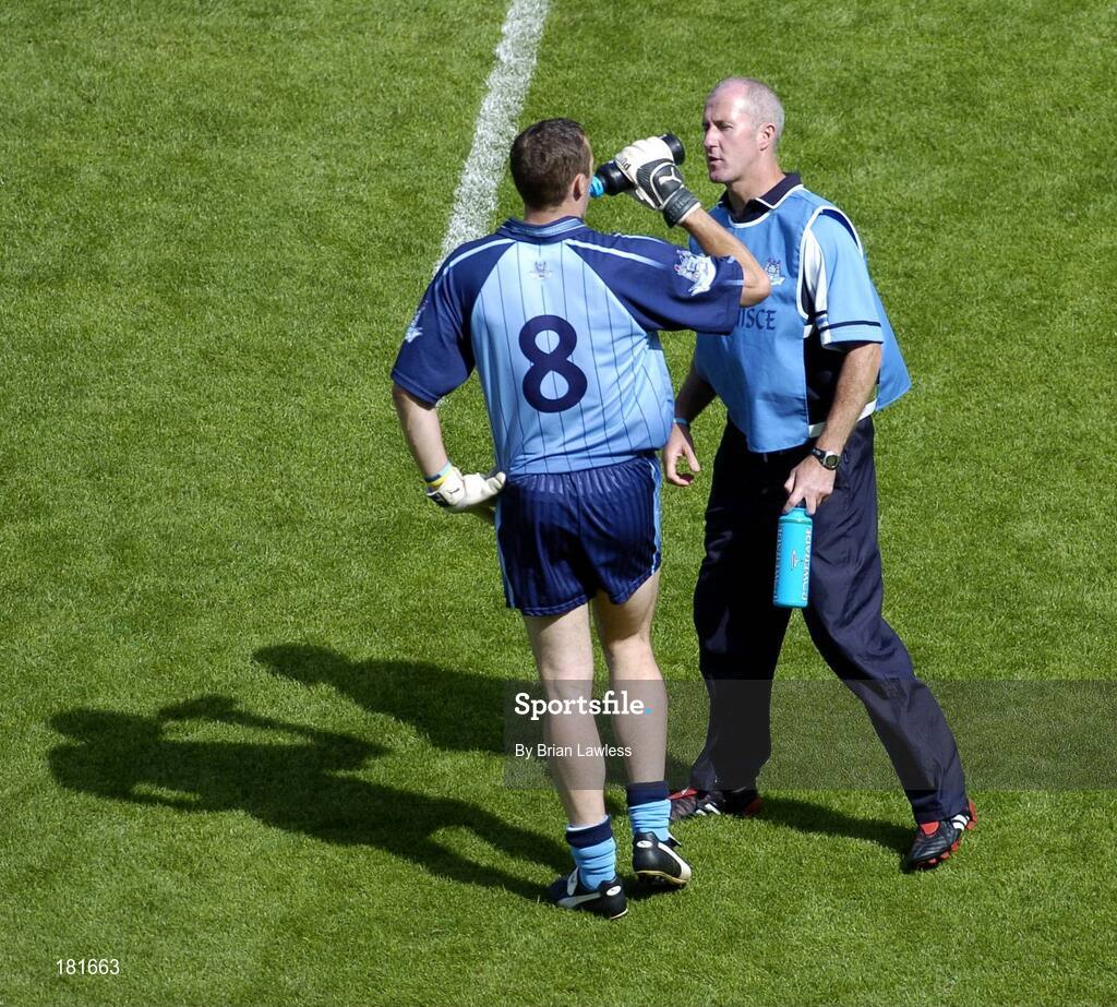 19 June 2005; Dublin's Ciaran Whelan takes a drink from Paul Clarke, Dublin selector. Bank of Ireland Leinster Senior Football Championship Semi-Final, Dublin v Wexford, Croke Park, Dublin. Picture credit; Brian Lawless / SPORTSFILE