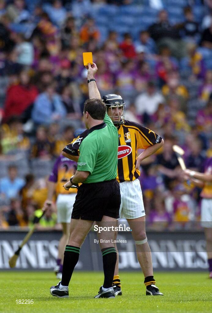 3 July 2005; Referee Seamus Roche shows Kilkenny's Derek Lyng a yellow card. Guinness Leinster Senior Hurling Championship Final, Kilkenny v Wexford, Croke Park, Dublin. Picture credit; Brian Lawless / SPORTSFILE