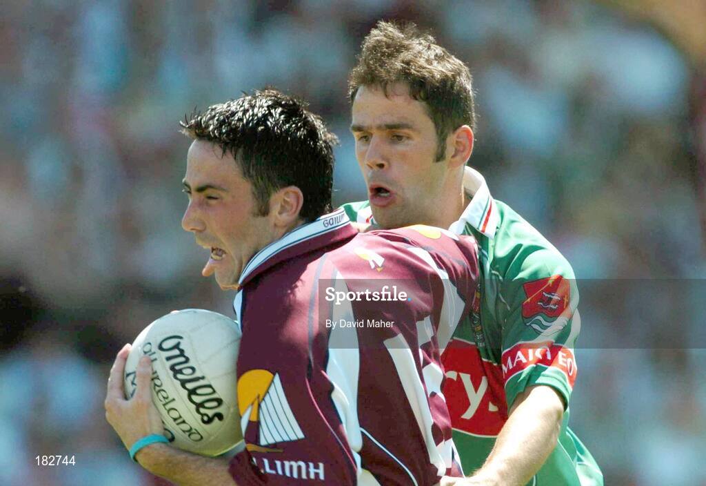 10 July 2005; Kieran Comer, Galway, is tackled by James Gill, Mayo. Bank of Ireland Connacht Senior Football Championship Final, Galway v Mayo, Pearse Stadium, Galway. Picture credit; David Maher / SPORTSFILE