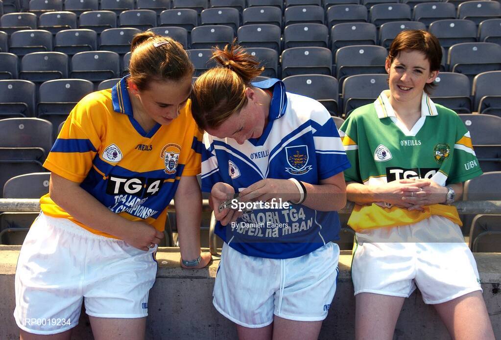 11 July 2005; Players Noreen Devery, Clare, left and Luchelle Claffey, Waterford view their photographs as Offaly's Clodagh Sullivan looks on at the launch of the 2005 TG4 All-Ireland Ladies Football Championship. Croke Park, Dublin. Picture credit; Damien Eagers / SPORTSFILE