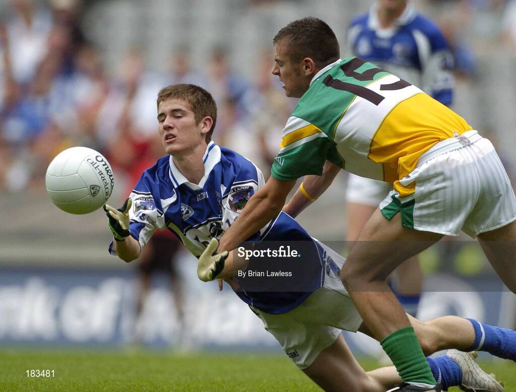 17 July 2005; Kevin Smith, Laois, is tackled by Ken Casey, Offaly. Leinster Minor Football Championship Final, Offaly v Laois, Croke Park, Dublin. Picture credit; Brian Lawless / SPORTSFILE